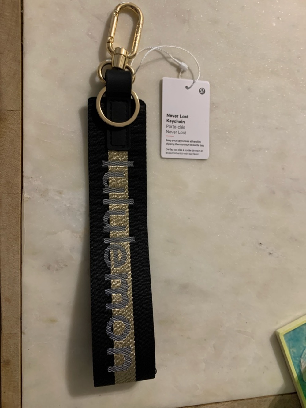 lululemon athletica Black and Gold Never Lost Keychain Wristlet